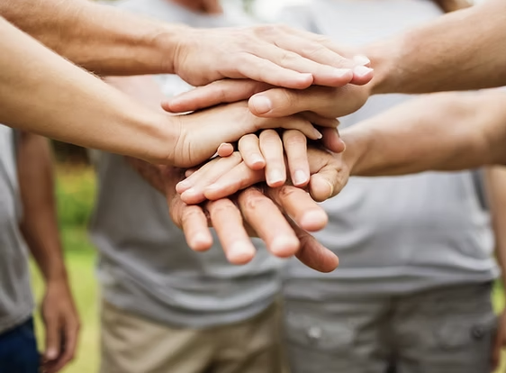 Community members joining hands